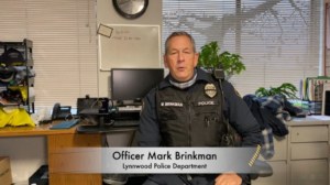 Officer Mark Brinkman at his desk discussing impaired driving